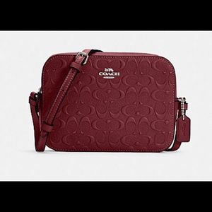 Mini camera bag in signature leather